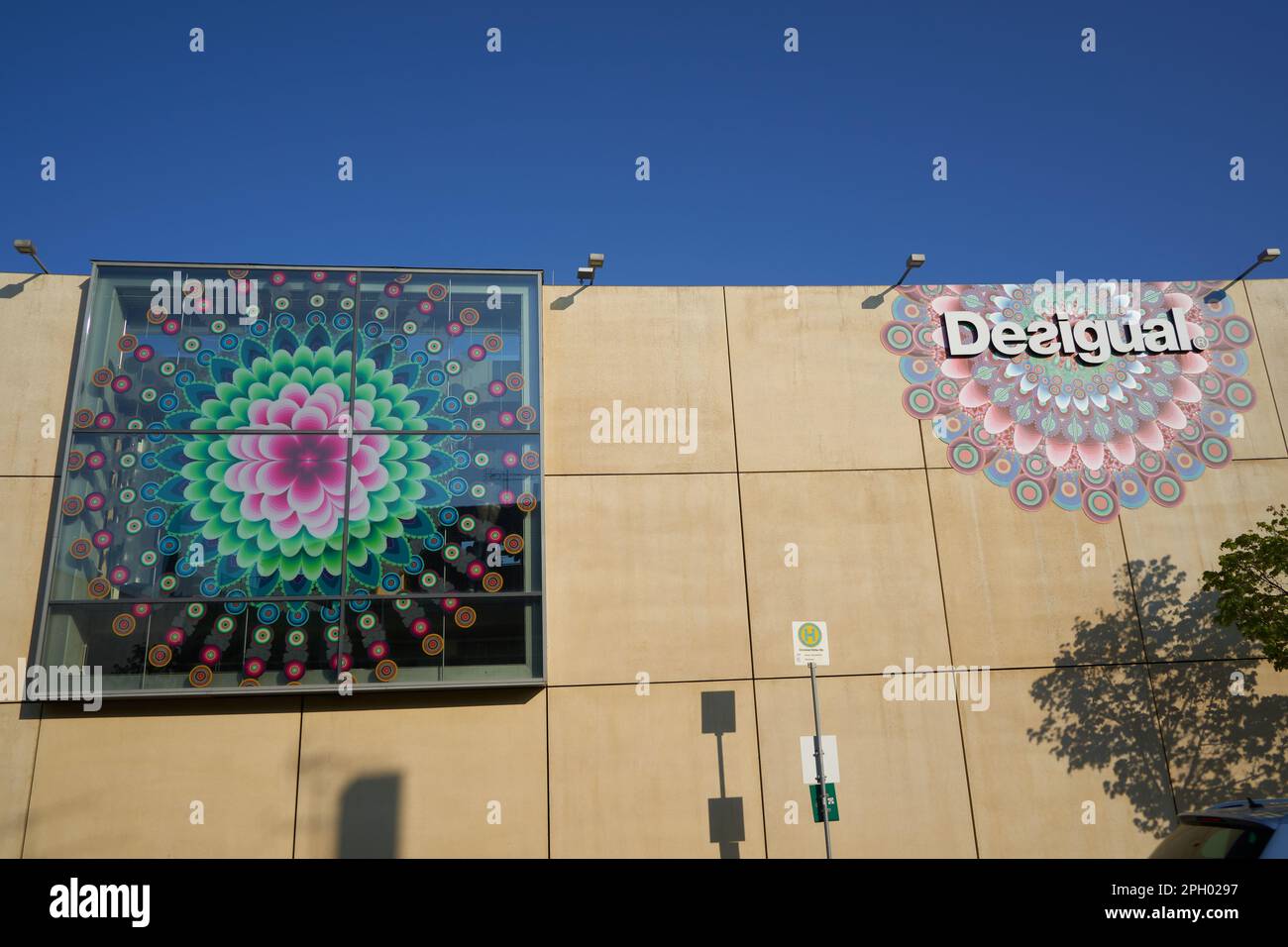 Metzingen, Germany - Mai 03, 2021: Desigual store. White letters in front  of colored pattern on a concrete facade. Blue sky for text. Sign of a bus  st Stock Photo - Alamy