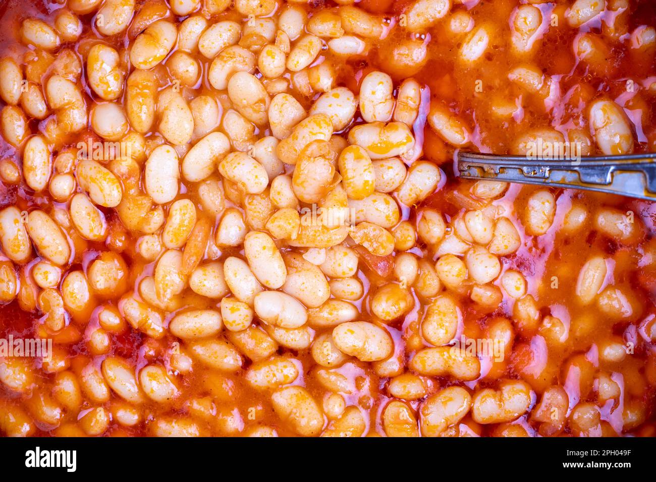 Dry bean meal. Top view of dried bean dish in a pot. Local name kuru