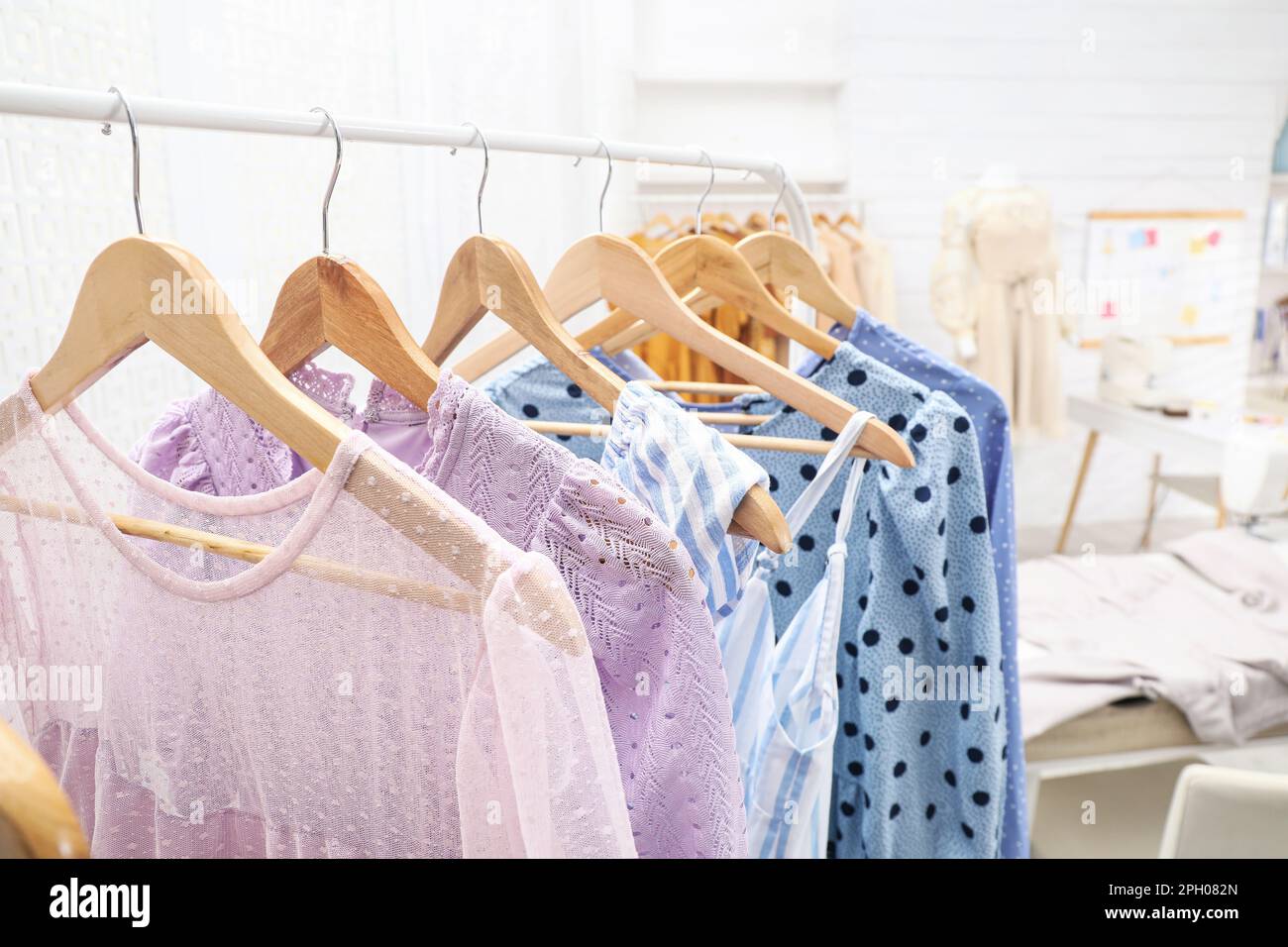 Collection of stylish female clothes in dressmaking Stock