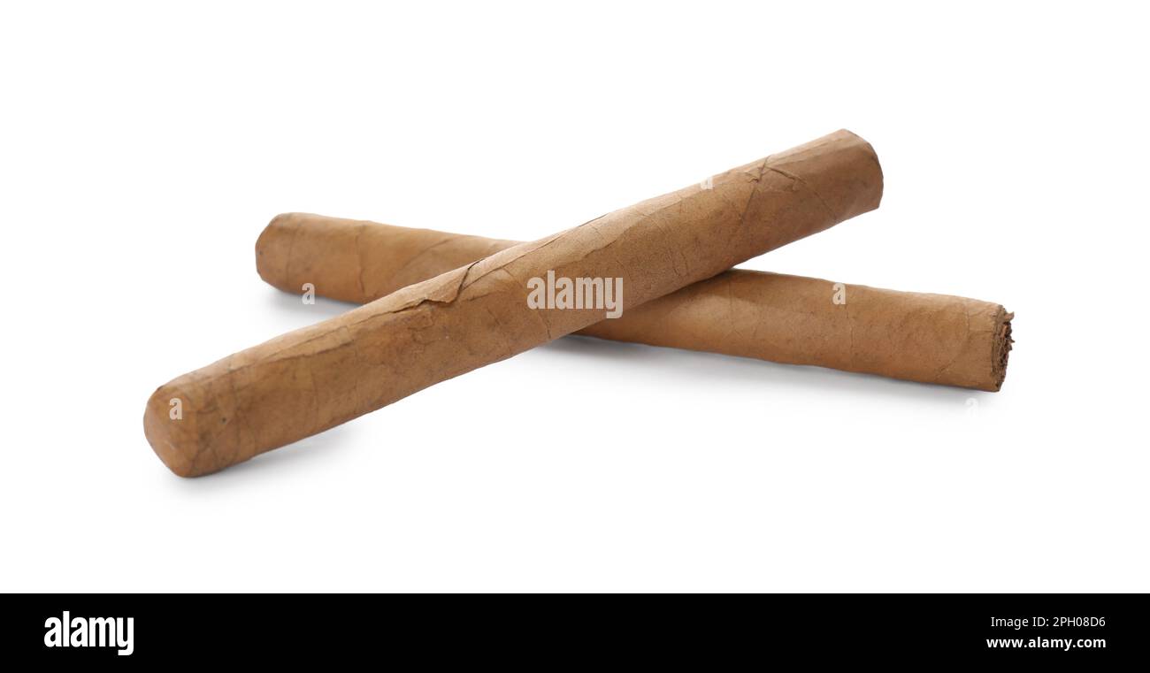 Cigars wrapped in tobacco leaves on white background Stock Photo Alamy