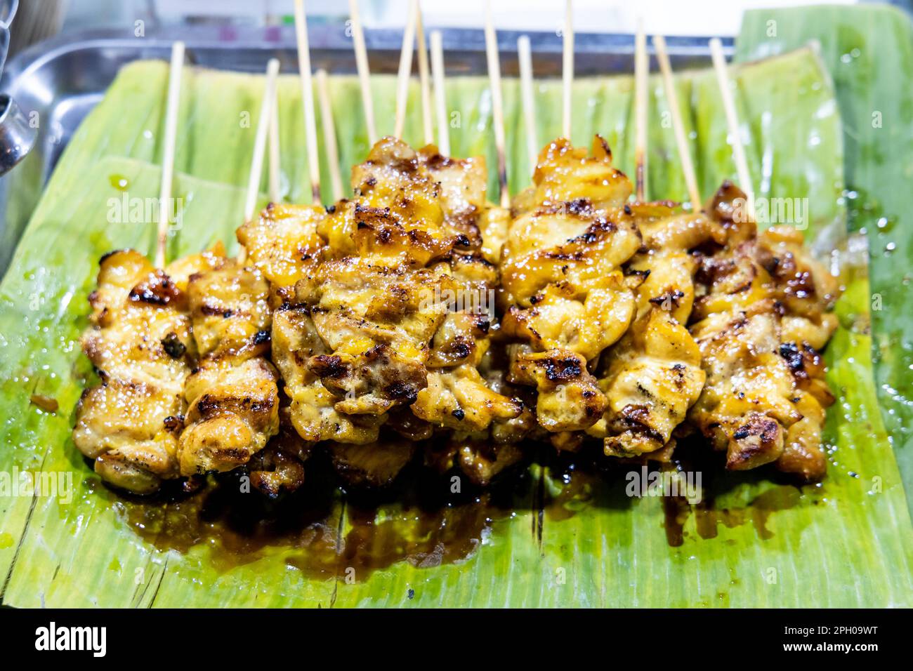 Moo Ping or Pork satay, is popular street food in Thailand Stock Photo ...