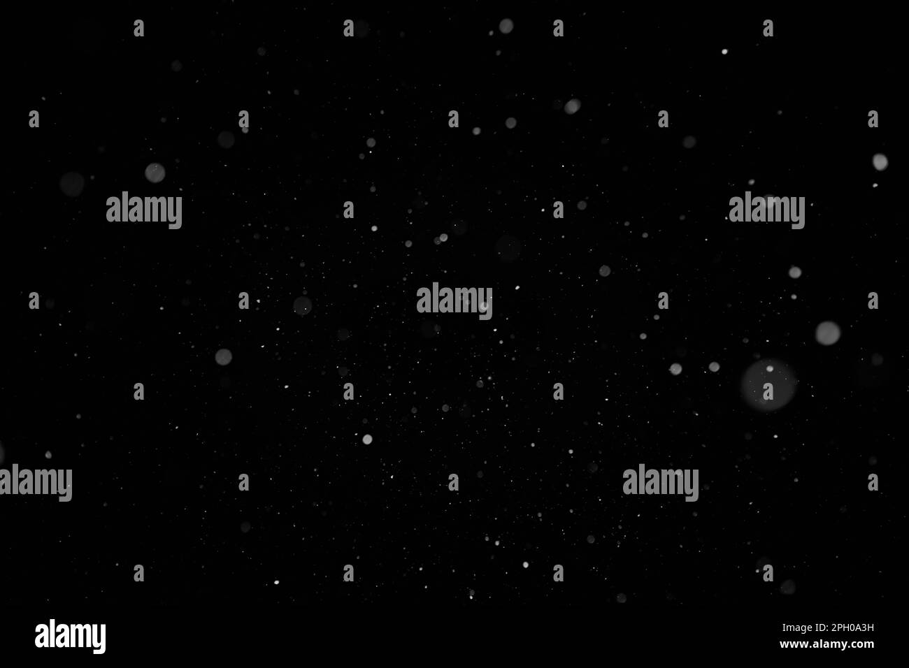 Snowflakes falling on blurred background Black and White Stock Photos ...