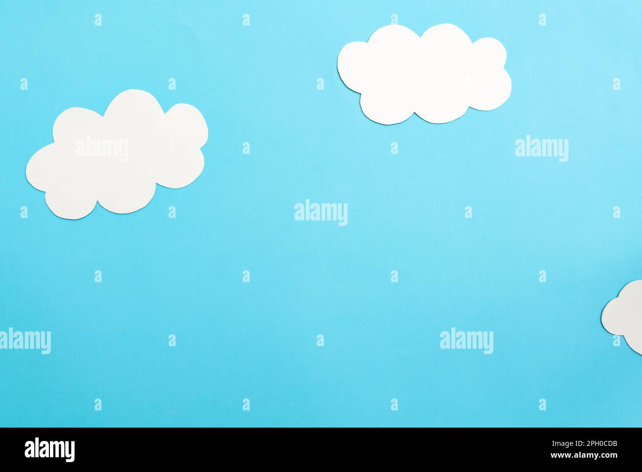 Paper clouds on blue background, flat lay, top view Stock Photo - Alamy