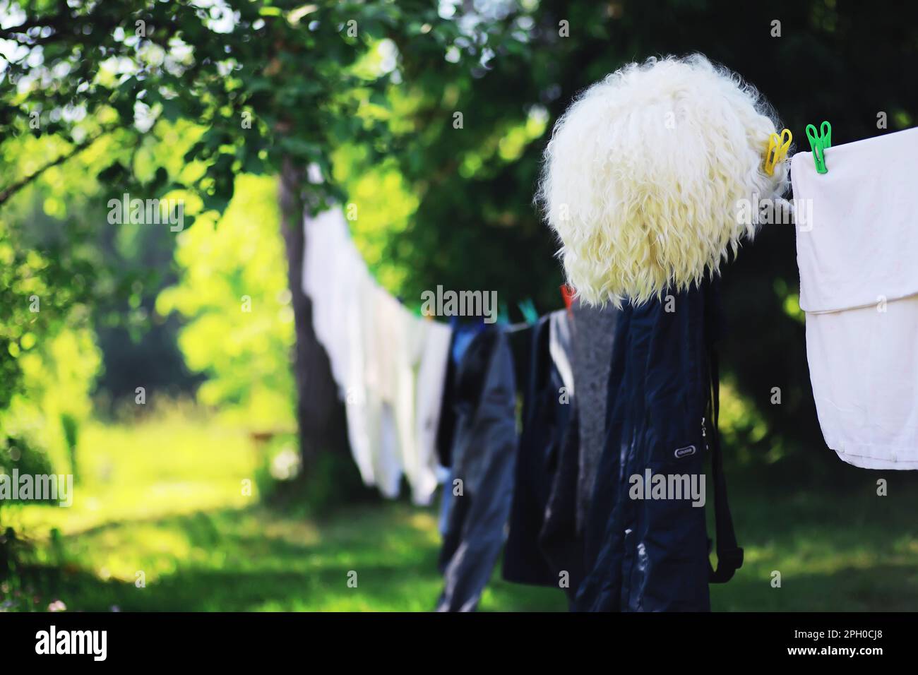 Clothespins on a clothesline in summer. Dry clothes outside. Clothes on