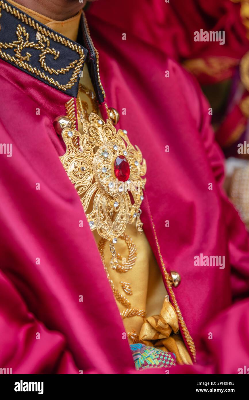 Traditional Balinese male wedding dress and chest gold jewelry. Bali