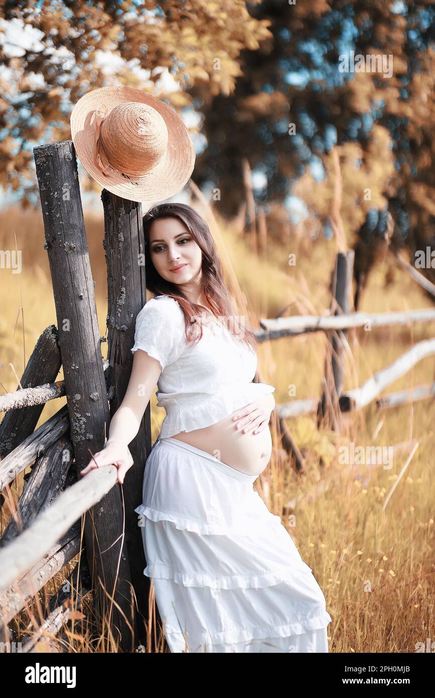 Pregnant woman in nature for a walk in the autumn Stock Photo - Alamy