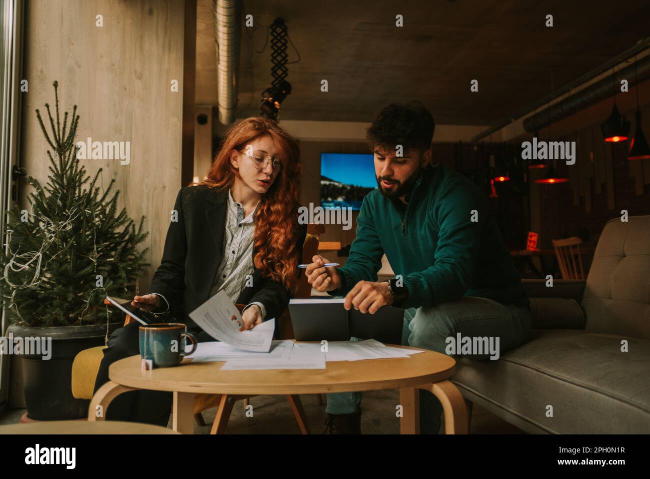 Low angle view photo of two Caucasian business people, male and female ...