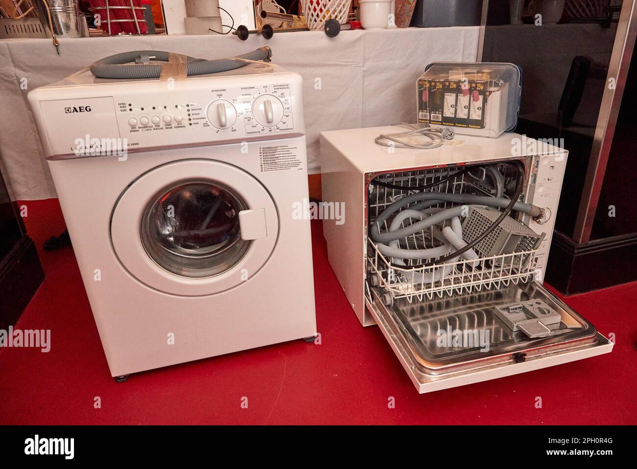 Hamburg, Germany. 25th Mar, 2023. A washing machine and a dish dryer stand  during a charity sale at the Hamburger Kammerspiele theater. The estate of  actor couple Nadja Tiller and Walter Giller