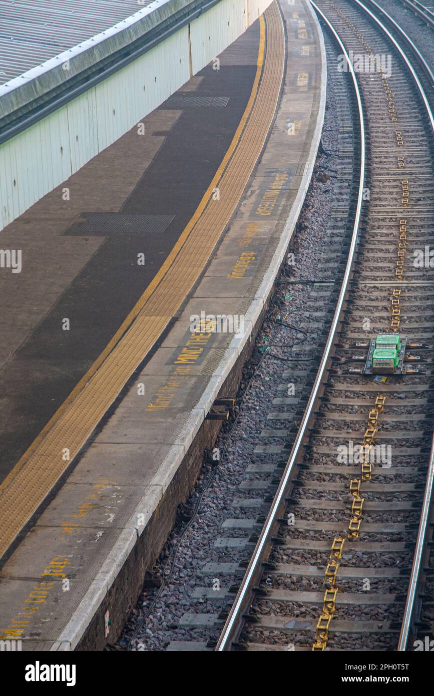 An empty train platform on a foggy day Stock Photo