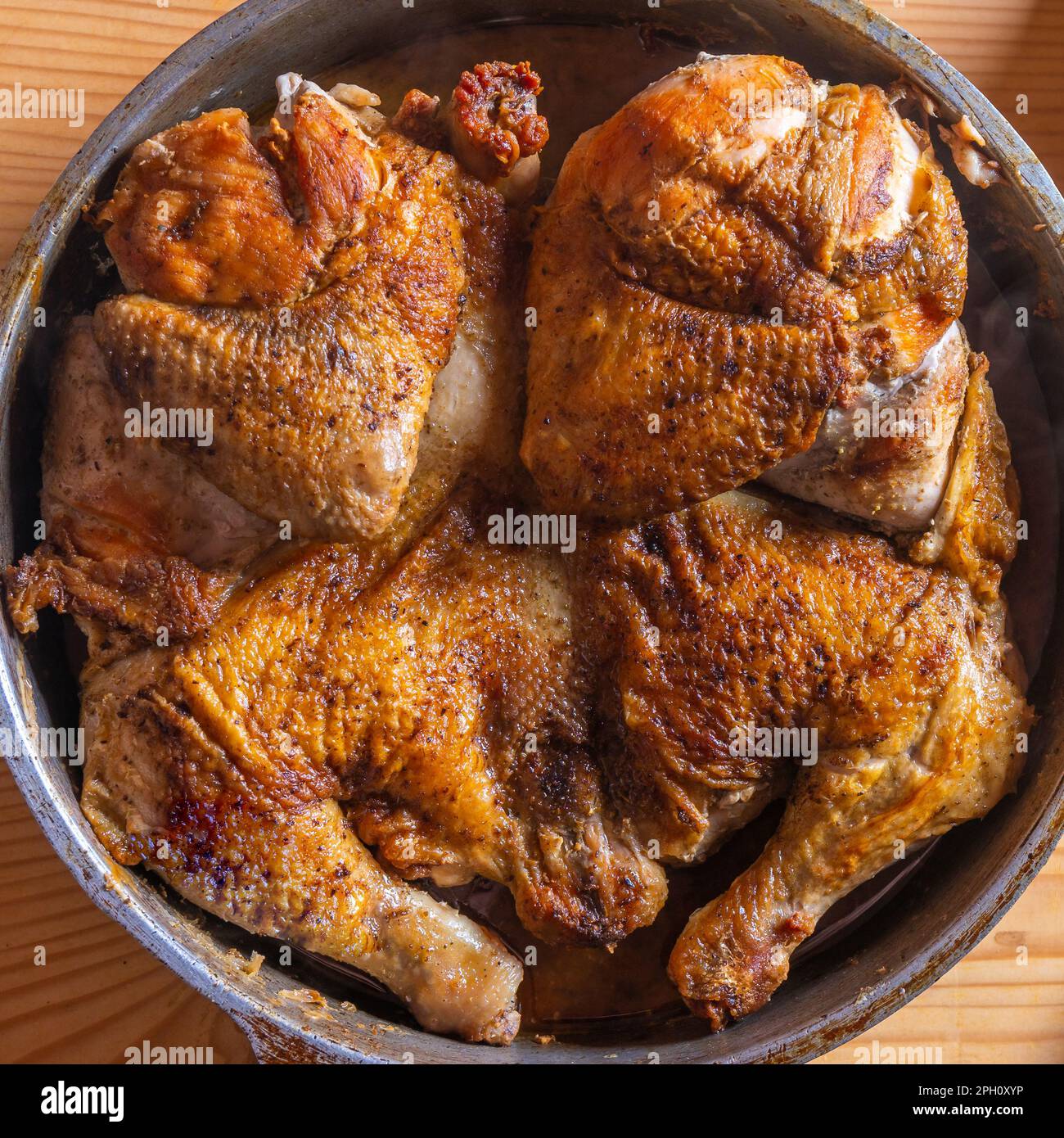 tobacco chicken Hot Fried Chicken tobacco in a pan close-up, food Stock Photo