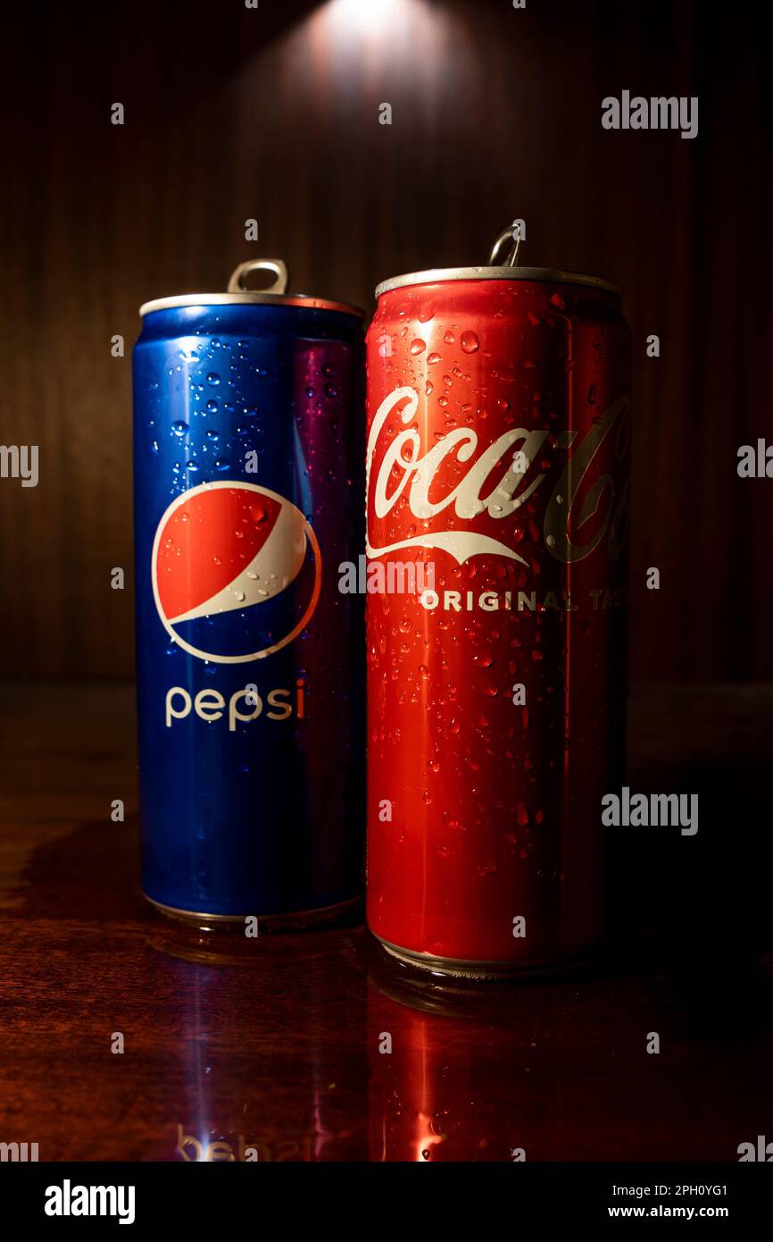 Pepsi and coke in the foreground, battle between the sides Stock Photo