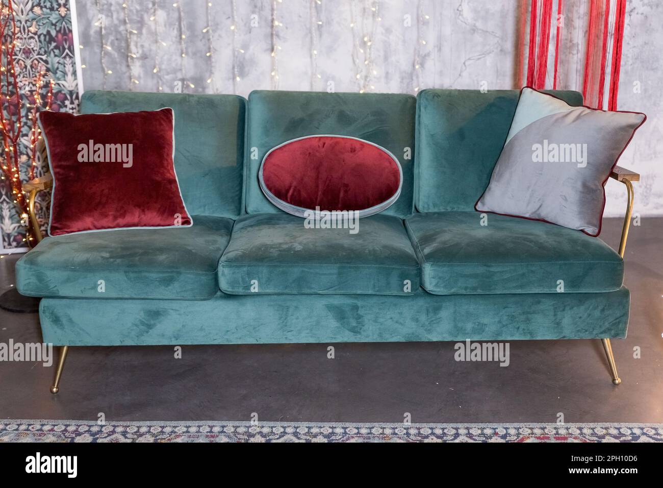 Exhibition of modern stylish upholstered furniture in the showroom of a  furniture store.Stylish comfortable settee with velour pillows, displayed  for Stock Photo - Alamy