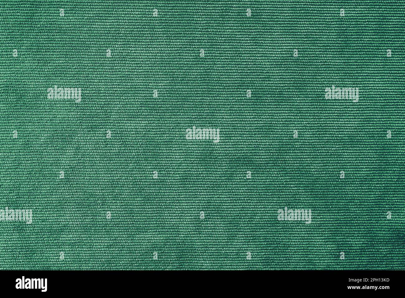 Texture background of velours green fabric. Upholstery velveteen