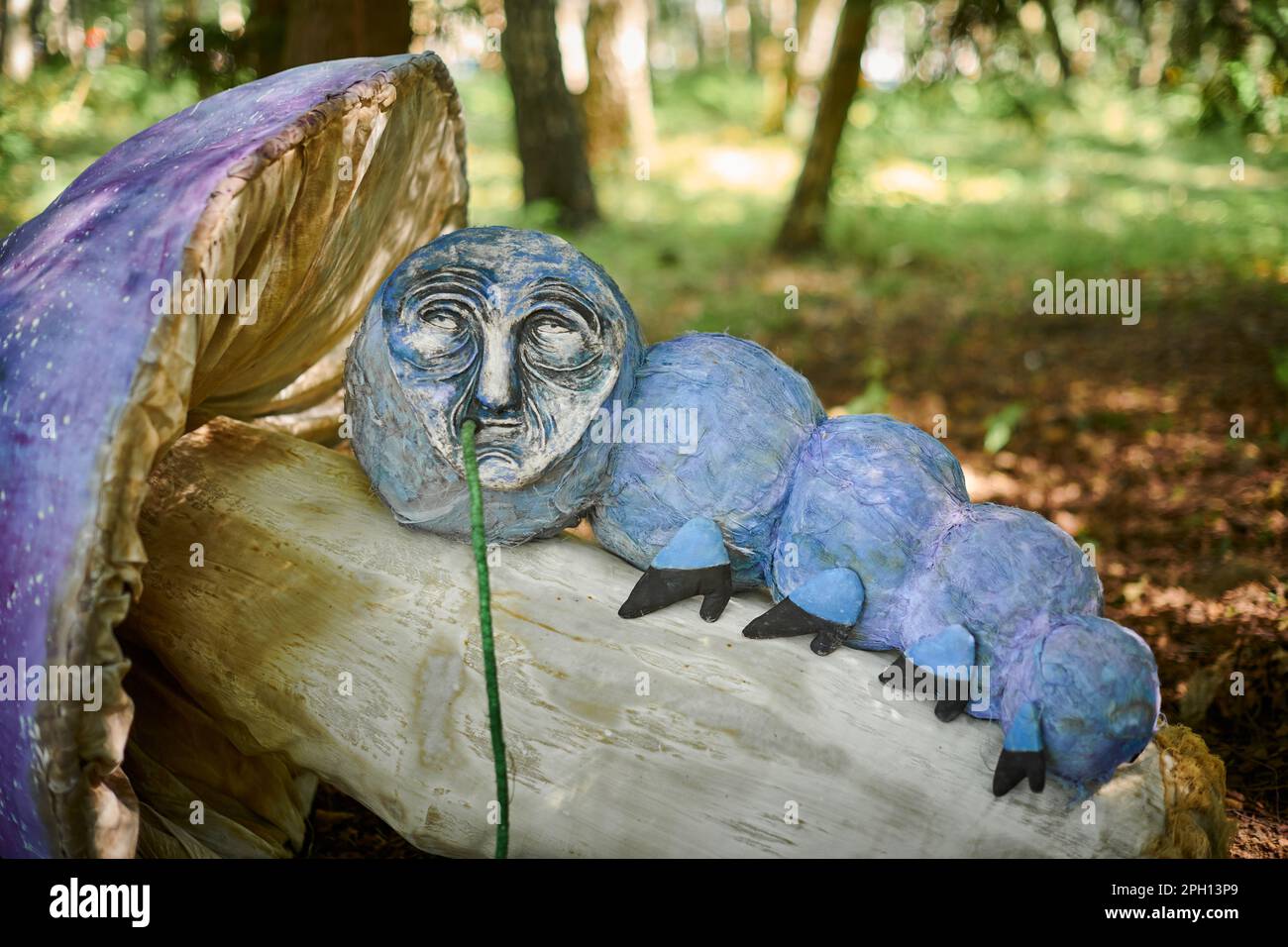 Hookah smoking caterpillar from Alice wonderland art object in outdoor