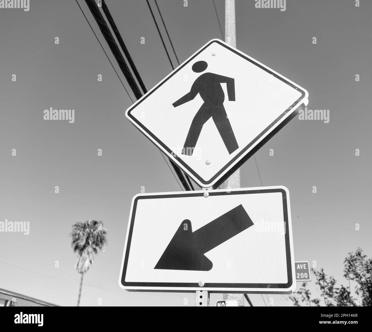 yellow road sign for pedestrian directing this way Stock Photo Alamy
