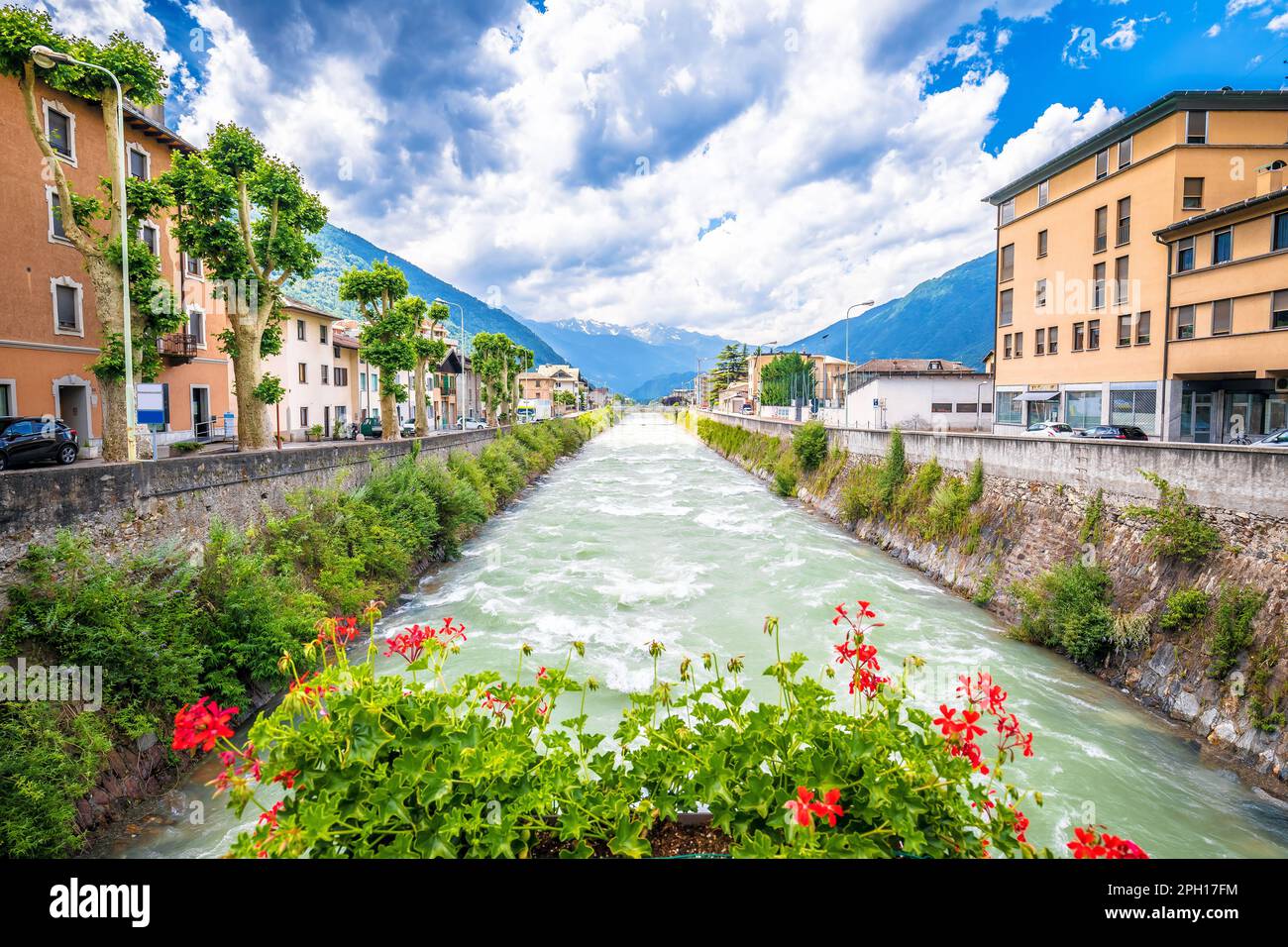 Town of Tirano and Adda river waterfront view, Province of Sondrio, Alps of Italy Stock Photo