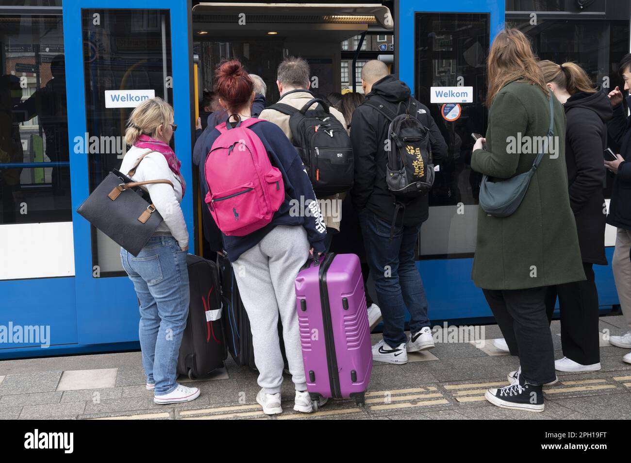 AMSTERDAM - Travelers board a tram in the center of Amsterdam. Public transport in the capital is being overhauled because the number of travelers has decreased due to the corona crisis. ANP EVERT ELZINGA netherlands out - belgium out Stock Photo