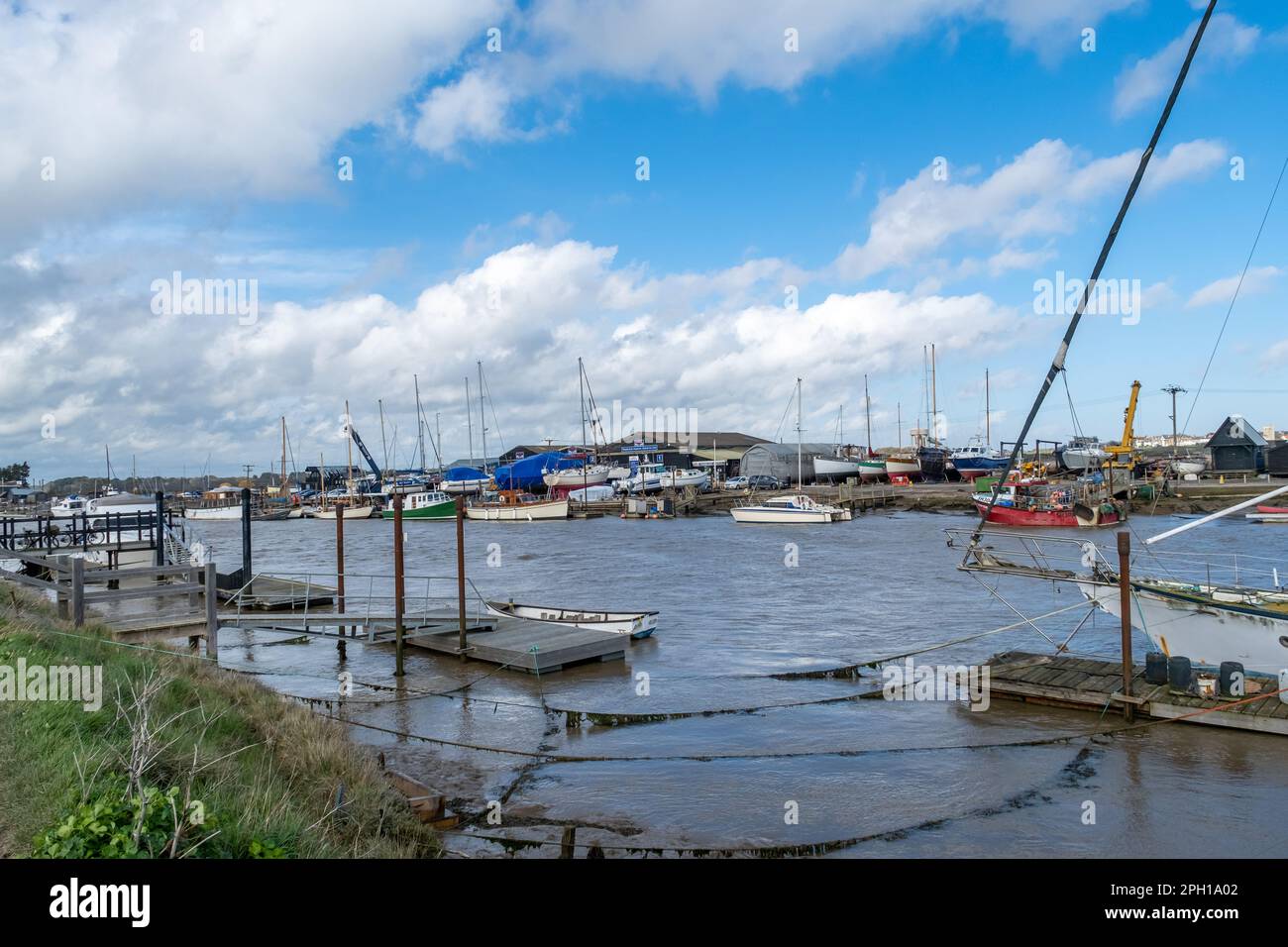Boats, jetties and piers on the River Blyth in Walberswick on the Suffolk coast Stock Photo