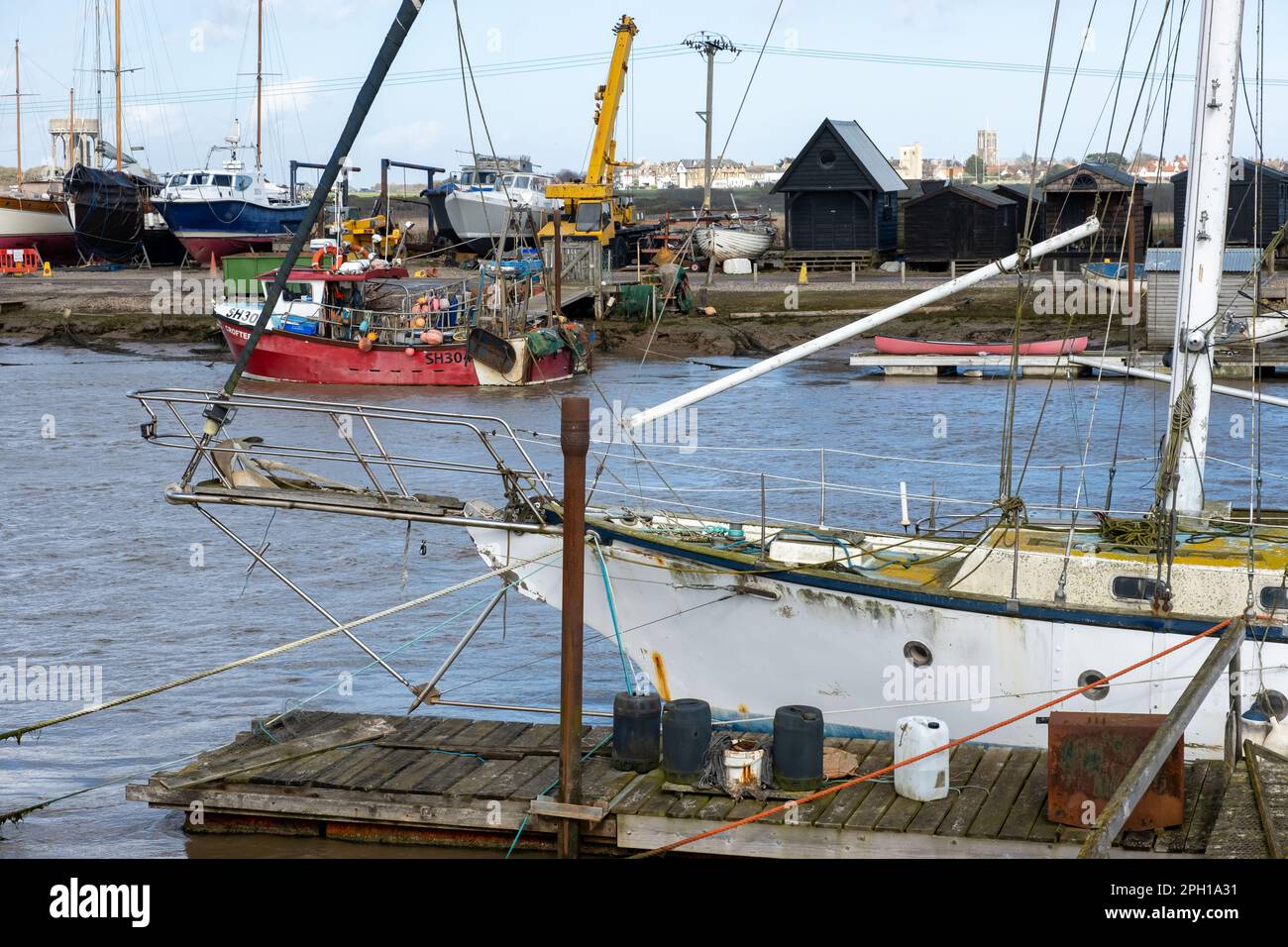 Boats moored on the River Blyth in Walberswick on the Suffolk Coas Stock Photo