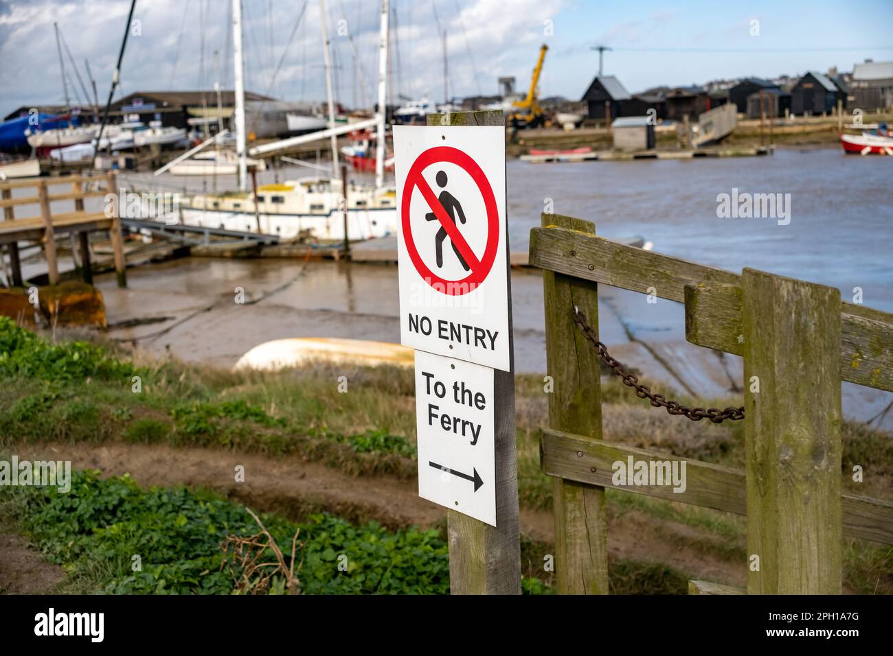 No entry sign to wooden piers and jetties on the River Blyth in Walberswick, Suffolk coast Stock Photo