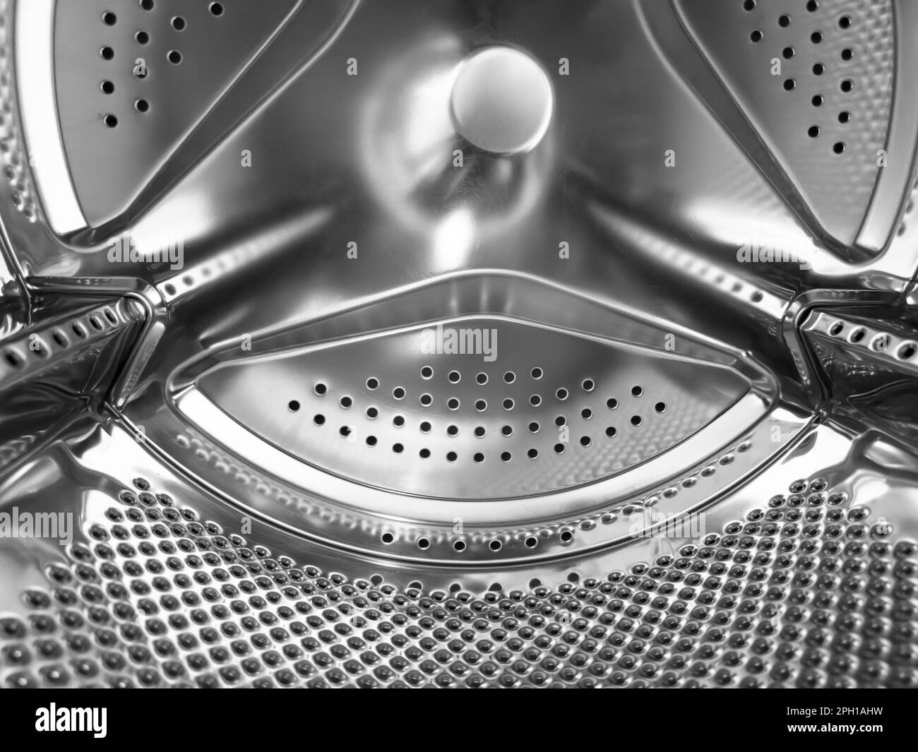 Washing machine drum close up. Washing machine background. Inside the