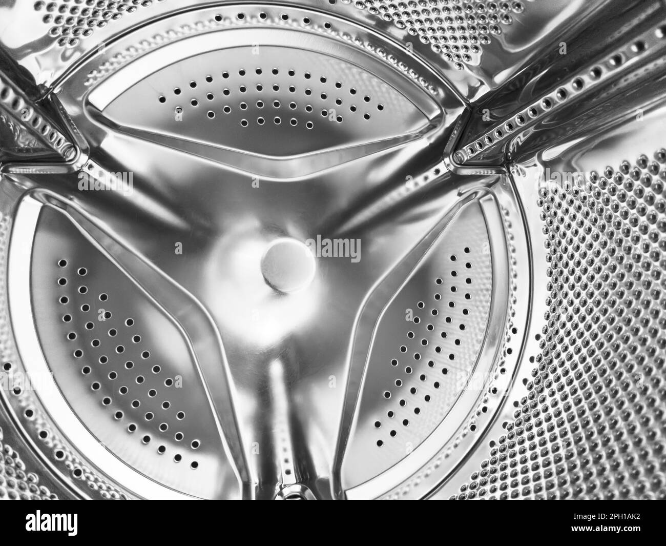 Washing machine drum close up. Washing machine background. Inside the