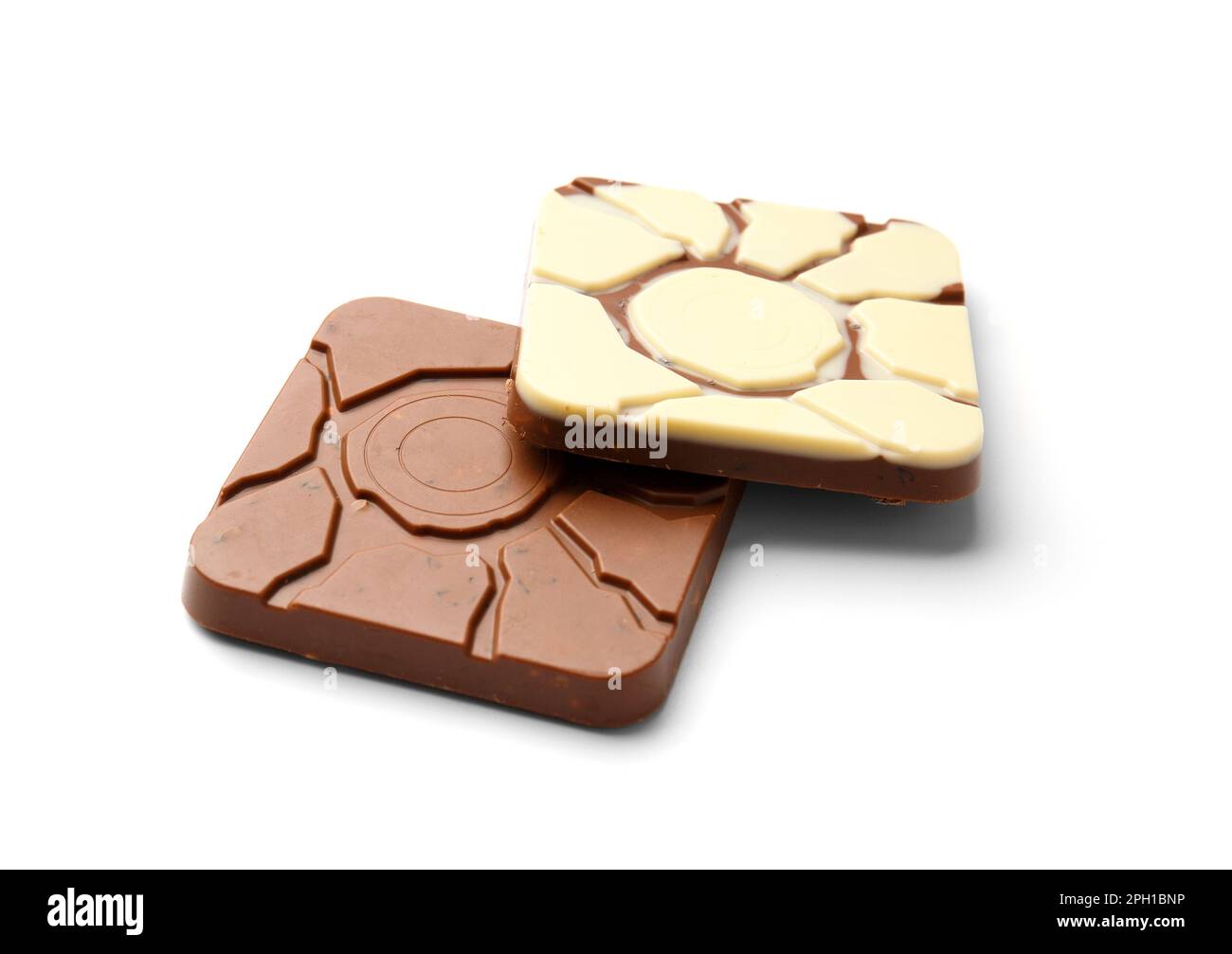 A bar of white and a bar of milk chocolate one on top of the other on a