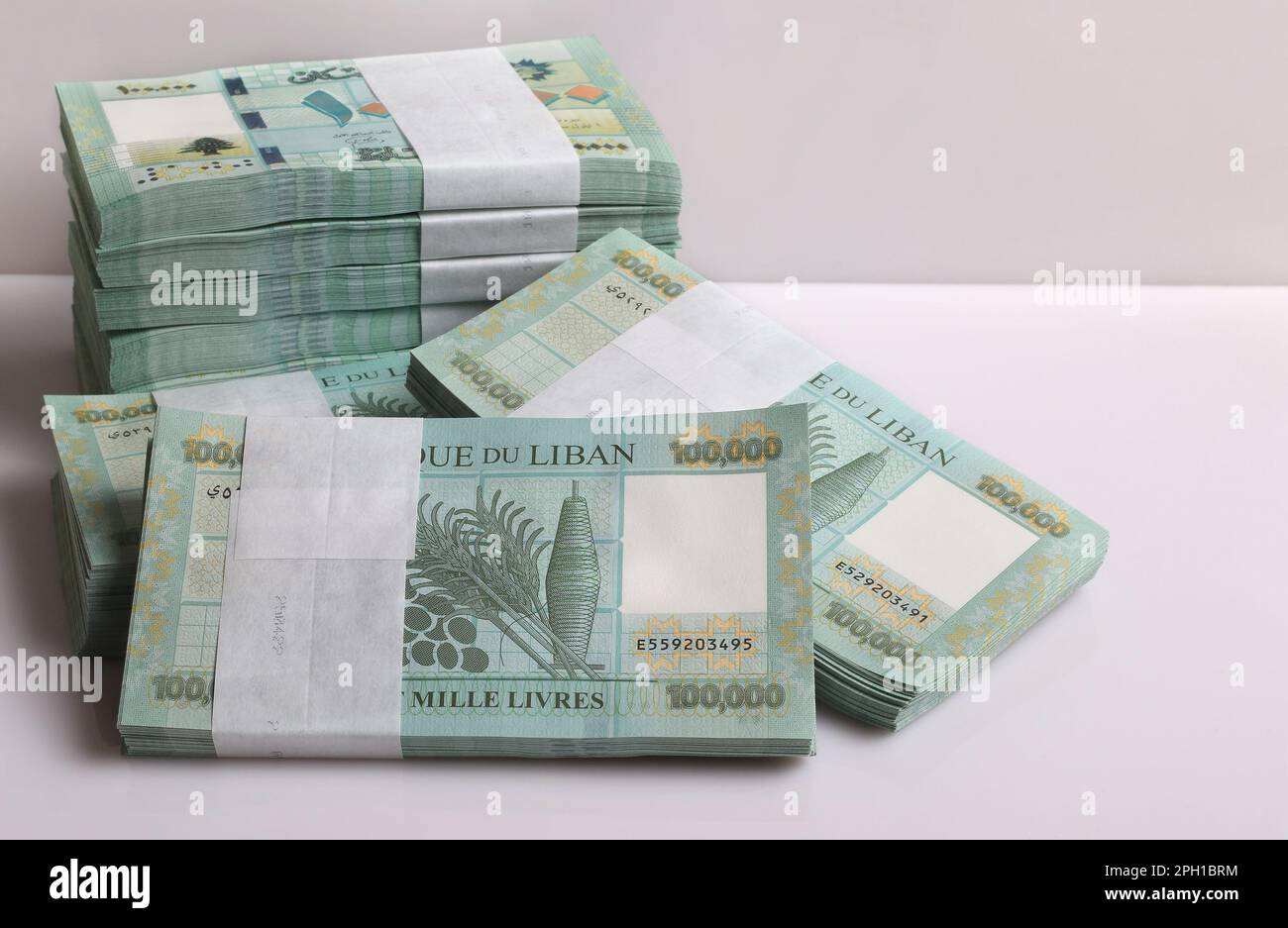 Stacks of Lebanese pounds, 100,000 denomination, symbolizing the
