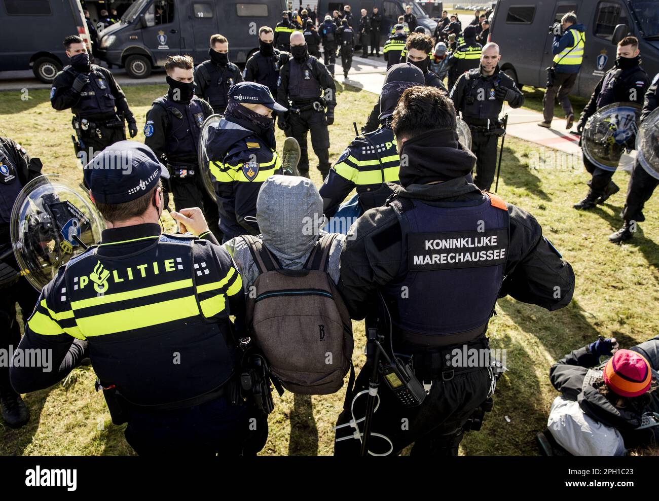 Eindhoven, Netherlands. 25th Mar 2023. EINDHOVEN - A climate activist from Extinction Rebellion is arrested during an action at Eindhoven Airport. The activists are very concerned about the damage that air traffic causes to the climate. ANP SEM VAN DER WAL netherlands out - belgium out Credit: ANP/Alamy Live News Stock Photo