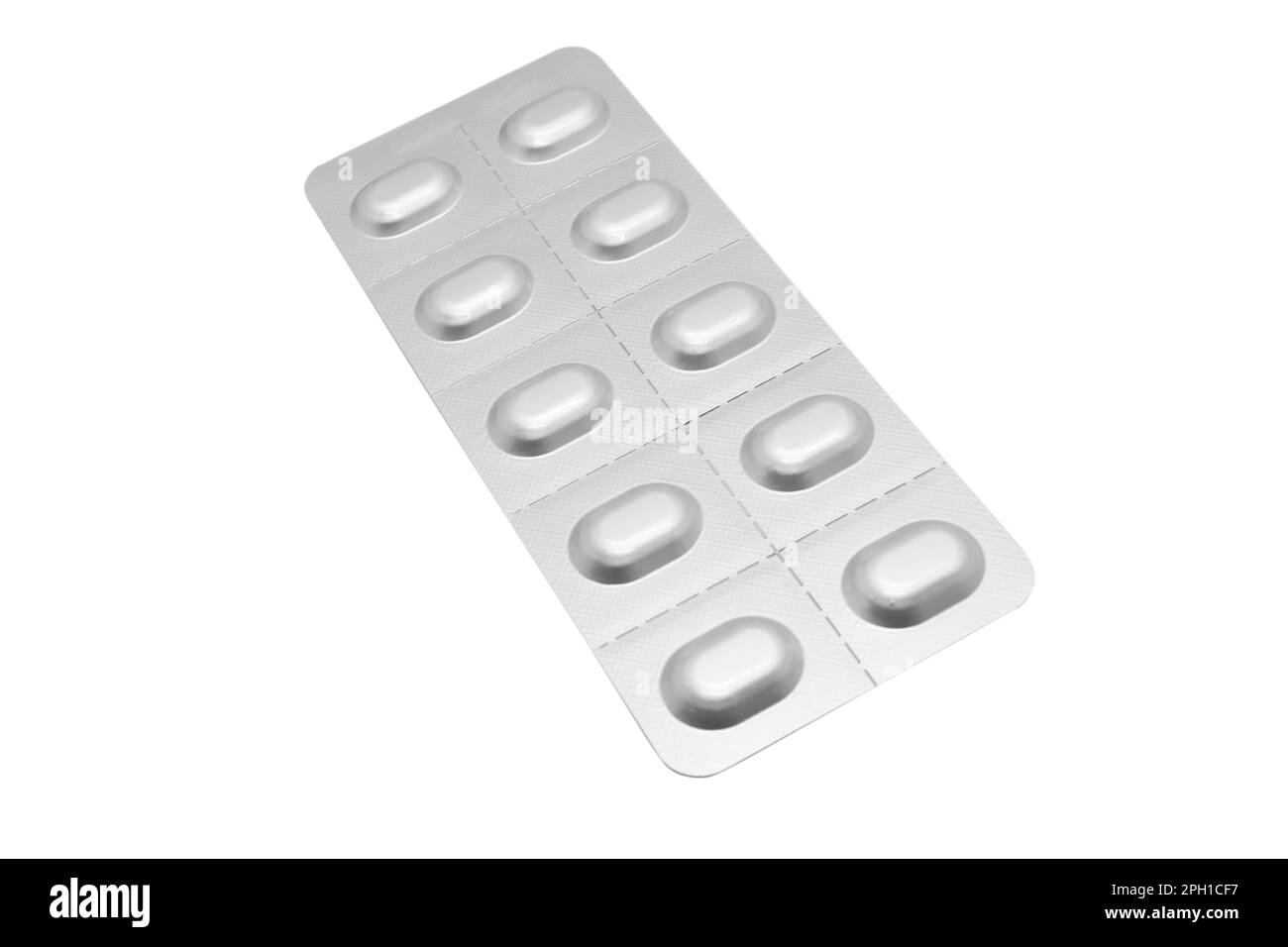 Macro shot pile of tablets pill in silver blister packaging isolated on white background. Aluminium foil blister pack. Pharmacy products. Medicine pil Stock Photo