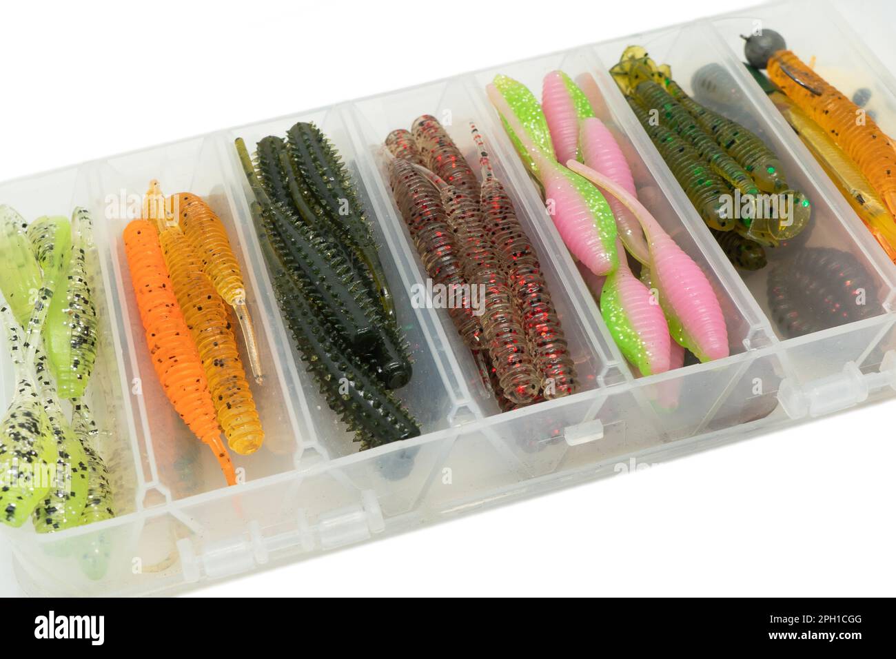 Jig silicone fishing lures in plastic tackle lure box. Silicone fishing  baits isolated. Colorful baits. Fishing spinning bait. Silicone soft  plastic Stock Photo - Alamy