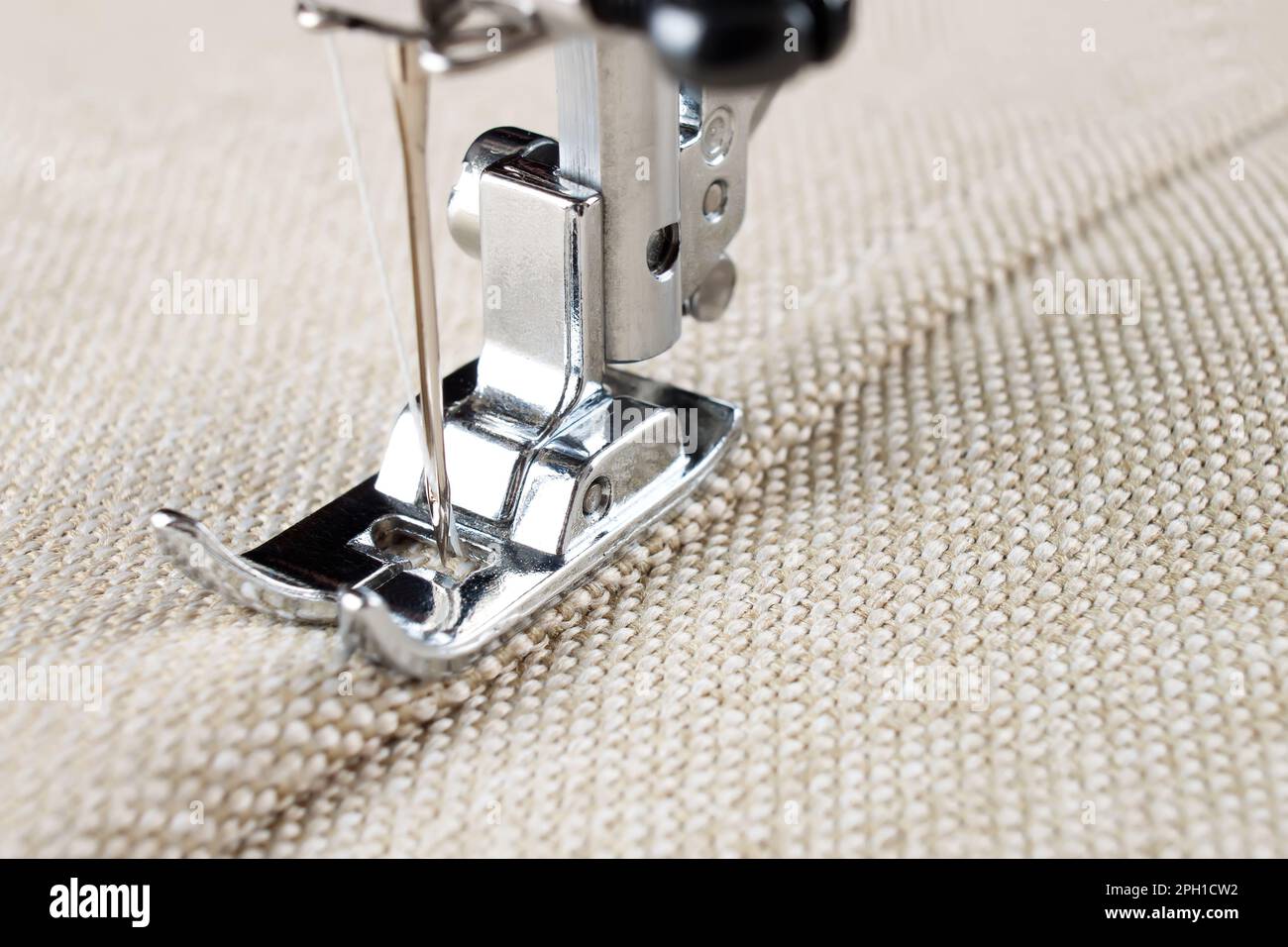 sewing machine makes a seam on fabric. sewing process Stock Photo Alamy