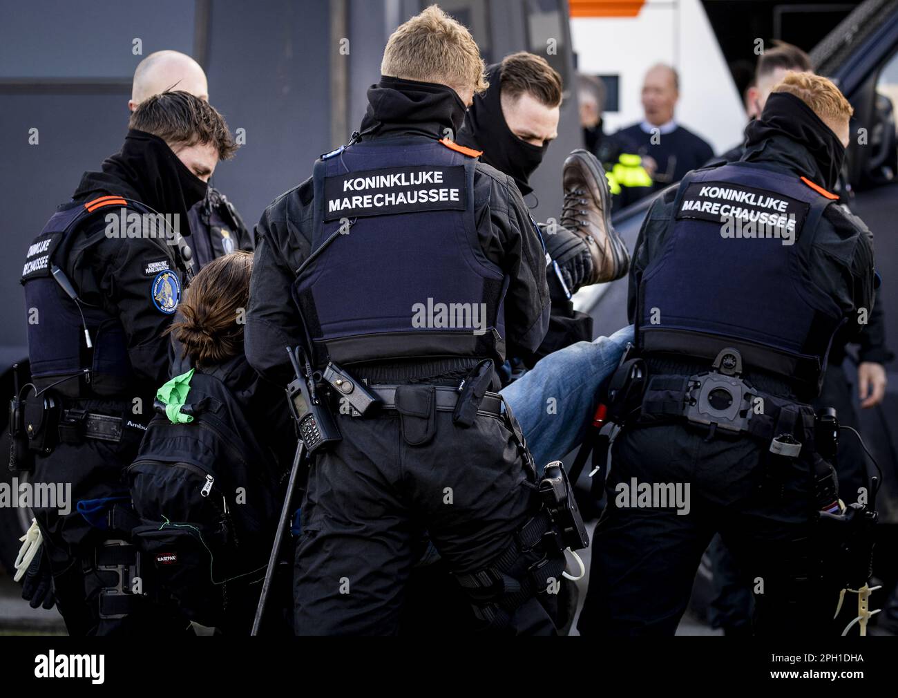 EINDHOVEN - A climate activist from Extinction Rebellion is arrested during an action at Eindhoven Airport. The activists are very concerned about the damage that air traffic causes to the climate. ANP SEM VAN DER WAL netherlands out - belgium out Stock Photo
