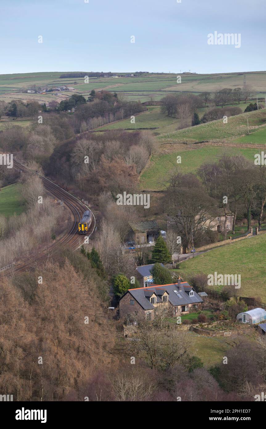 Northern Rail class 156 DMU train in the Derbyshire countryside passing ChapelEnLeFrith on
