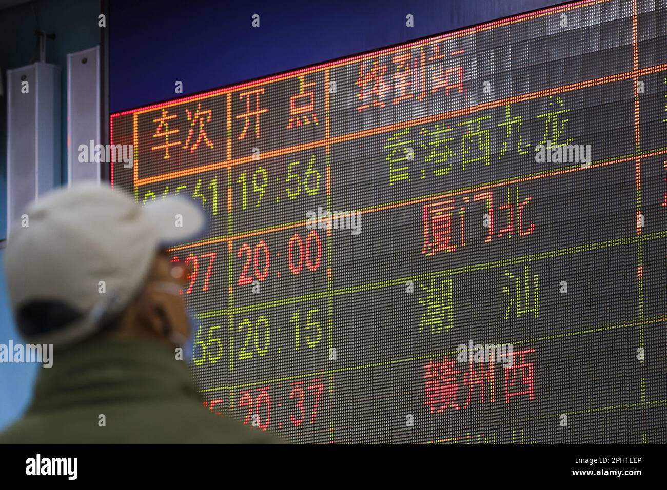 Passengers check the train departure time at Guangzhoudong Railway station (Guangzhou East Station). The High-Speed Rail (Hong Kong Section) resumes its short-haul services to Guangzhou for the first time in three years after Beijing has eased anti-pandemic restriction for Covid-19. 15JAN23 SCMP/ Dickson Lee Stock Photo