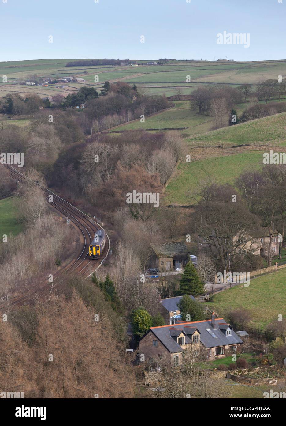 Northern Rail class 156 DMU train in the Derbyshire countryside passing