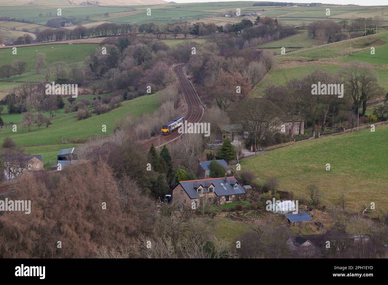 Northern Rail class 150 DMU train in the Derbyshire countryside passing