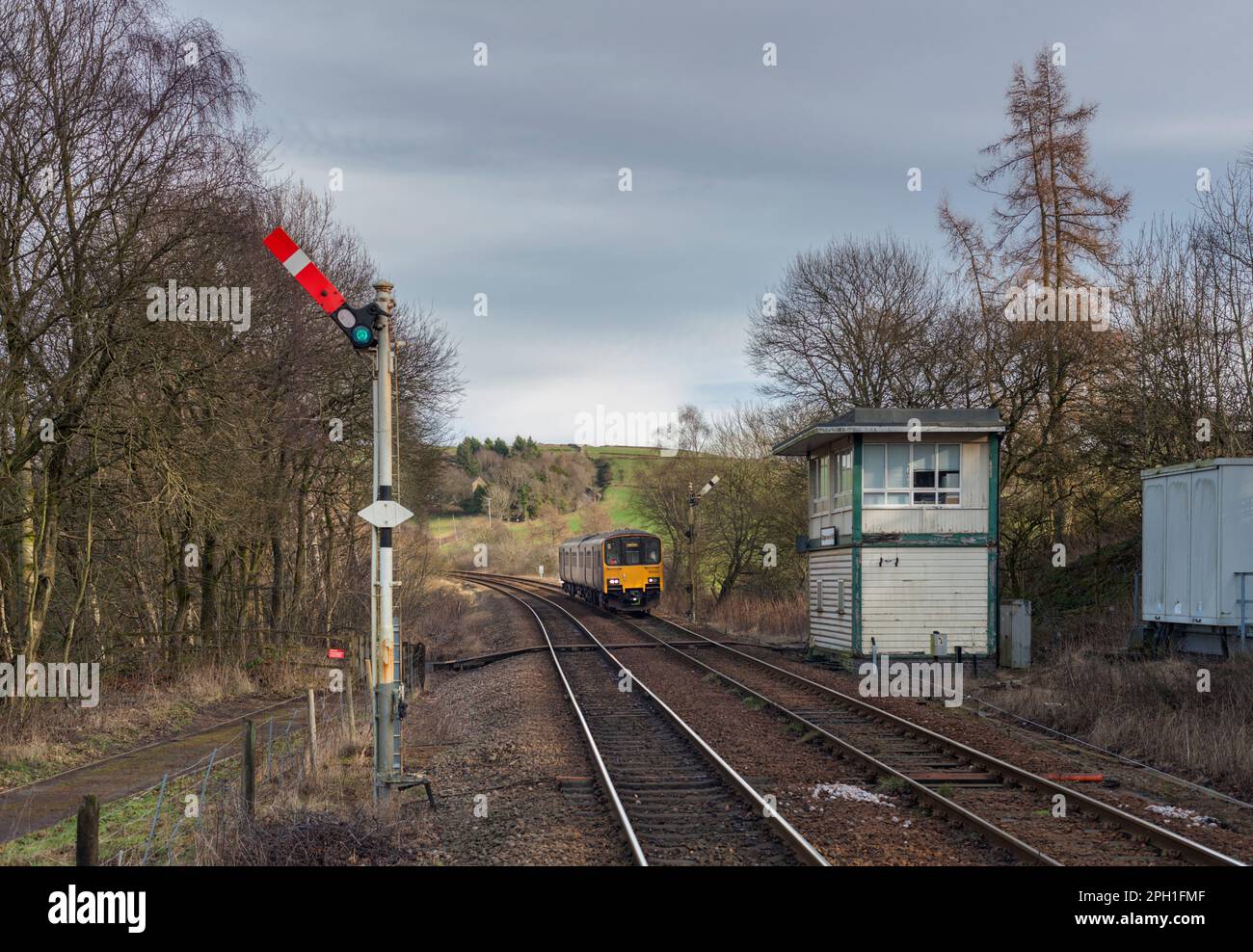 Northern Rail class 150 Diesel multiple unit train 150102 passing the mechanical signal box and