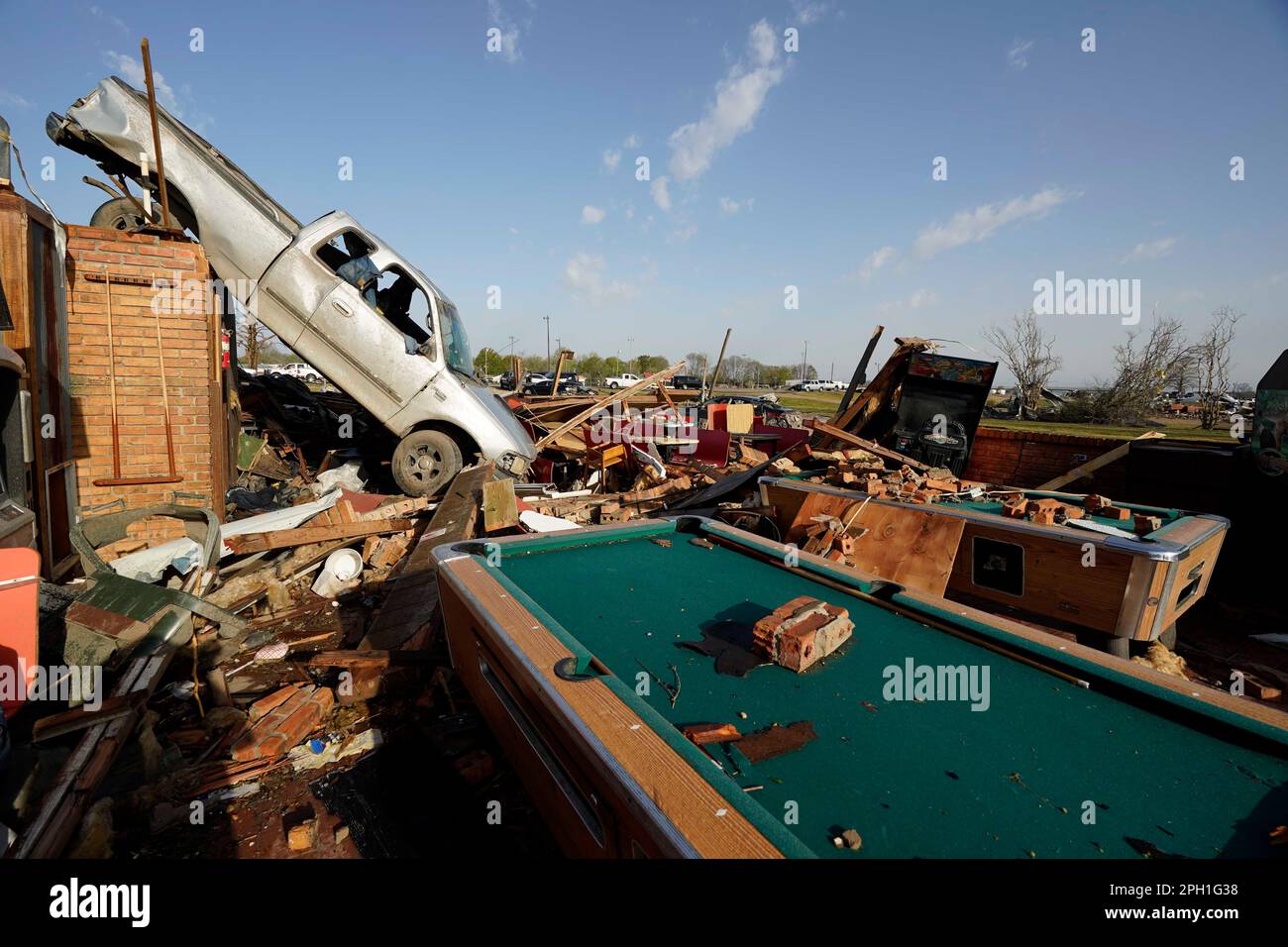 A pickup truck rests on top of a restaurant cooler at Chuck's Dairy