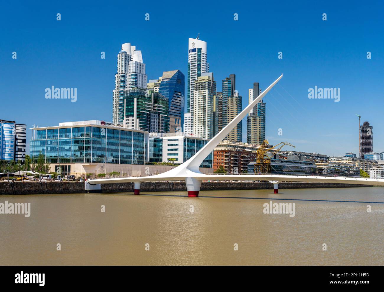 Buenos Aires, Argentina - 7 February 2023: Footbridge and modern offices and apartments in Puerto Madero district Stock Photo