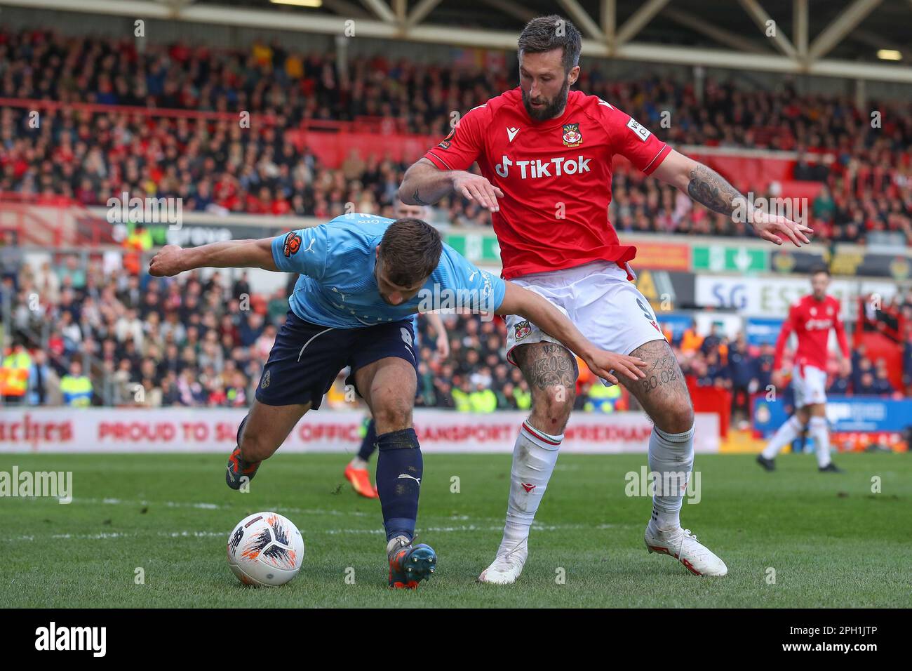 Ollie Palmer 9 of Wrexham fouls Olly Dyson 8 of York City during the