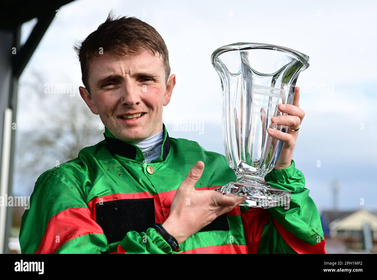 Jockey Chris Hayes celebrates after winning the Paddy Power Irish