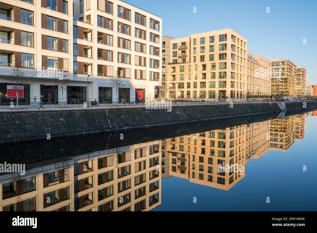 New apartment buildings in Berlin reflected in a small canal Stock Photo