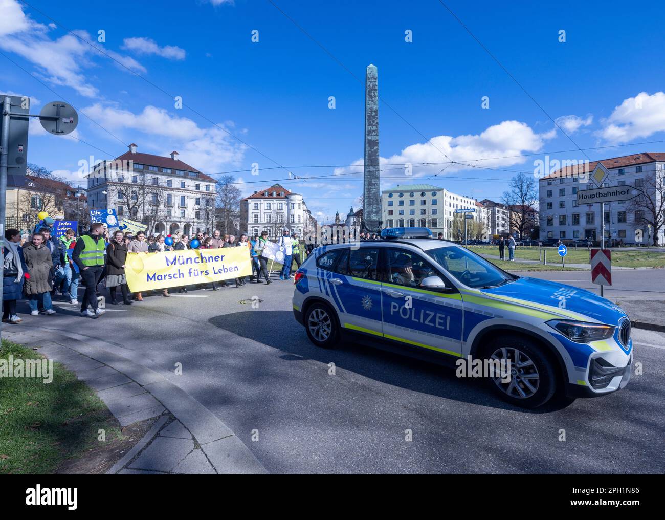 Munich, Germany. 25 March 2023. police car leads anti-abortion supporters street march, Munich, Germany Stock Photo