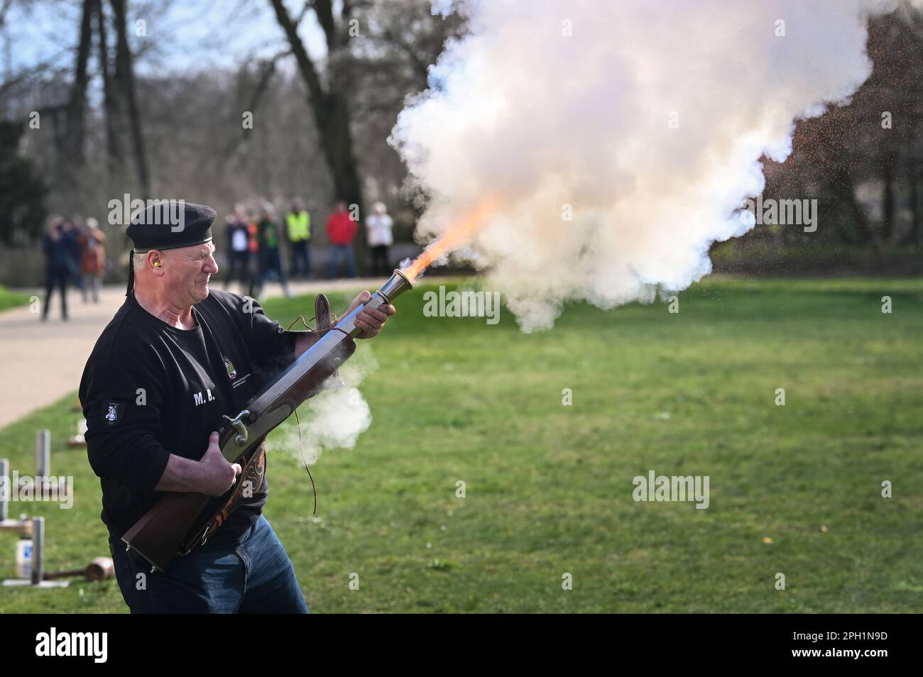 25 March 2023, Saxony-Anhalt, Lutherstadt Wittenberg: Martin Bormann of the State Boeller Battery fires a hand-held boeller gun at the 33rd Association Day of the State Shooting Association. With 19,900 members in 455 clubs nationwide in the new German states, the Landesschützenverband is the fourth-largest professional association in the Landessportbund. Photo: Heiko Rebsch/dpa/ZB Stock Photo