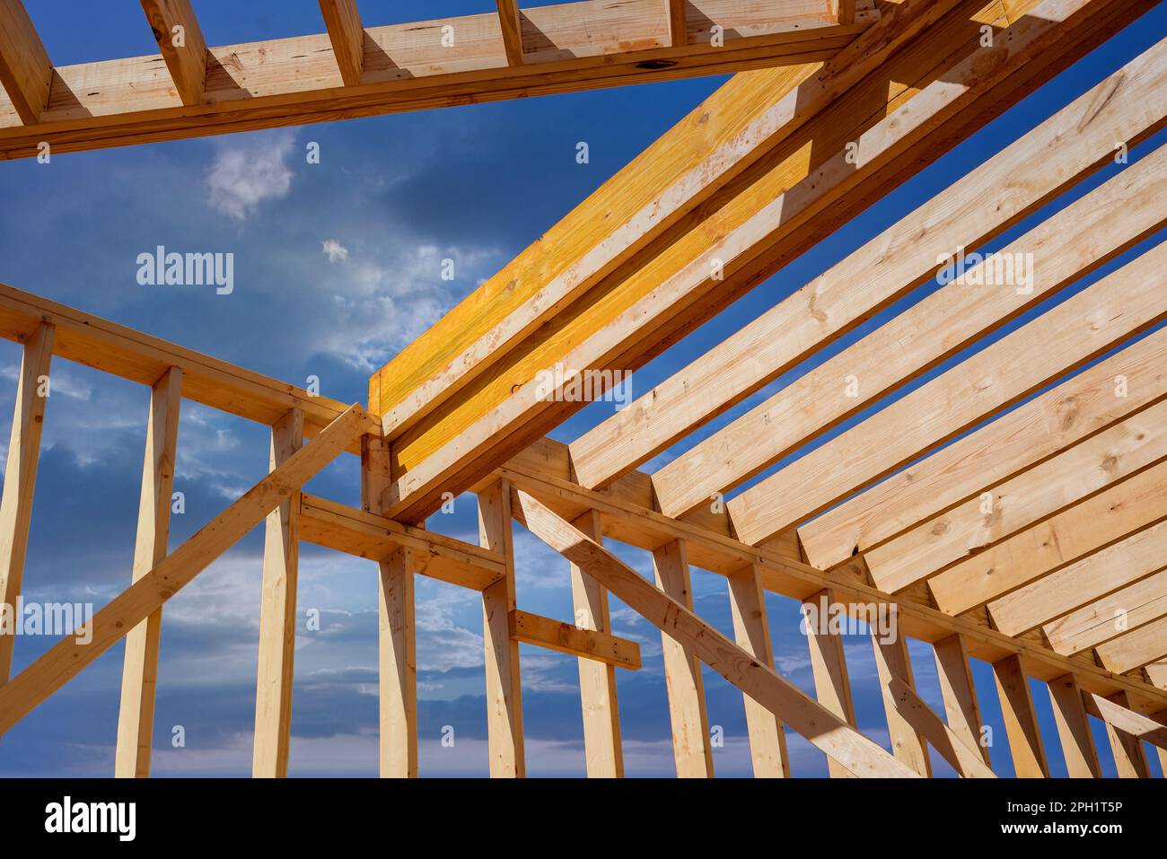 Framing beam provides structural support layout of joists to new built wooden home Stock Photo