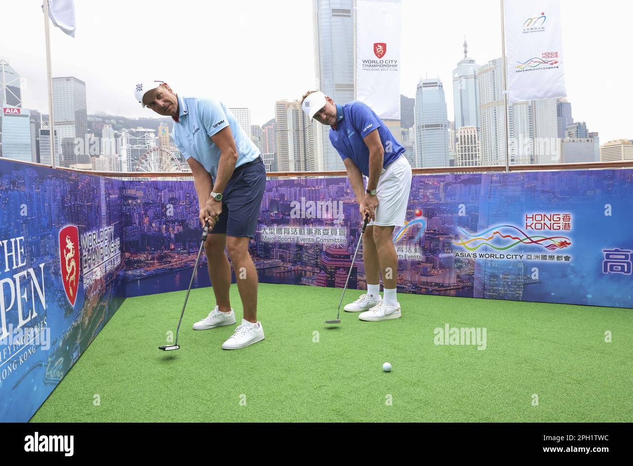 From Left; Henrik Stenson  and Ian Poulter attend a photo taking session of World City  Championship by HK Golf Club, by Victoria Harbour.  21MAR23  SCMP / K. Y. Cheng Stock Photo