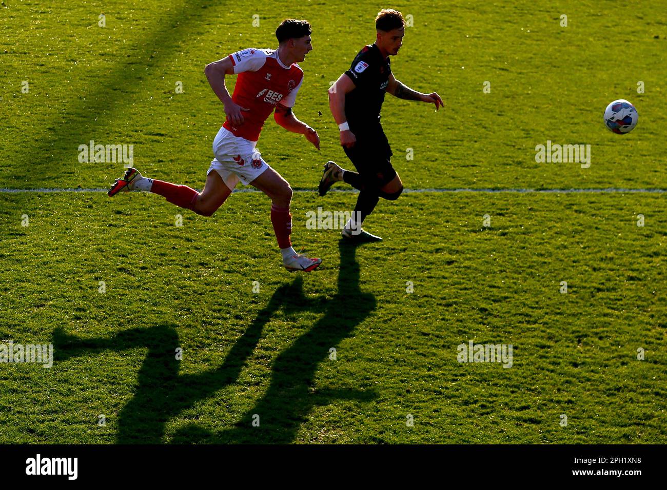 Fleetwood Town's Harvey Macadam (left) and Lincoln City's Harry Boyes battle for the ball during the Sky Bet League One match at Highbury Stadium, Fleetwood. Picture date: Saturday March 25, 2023. Stock Photo