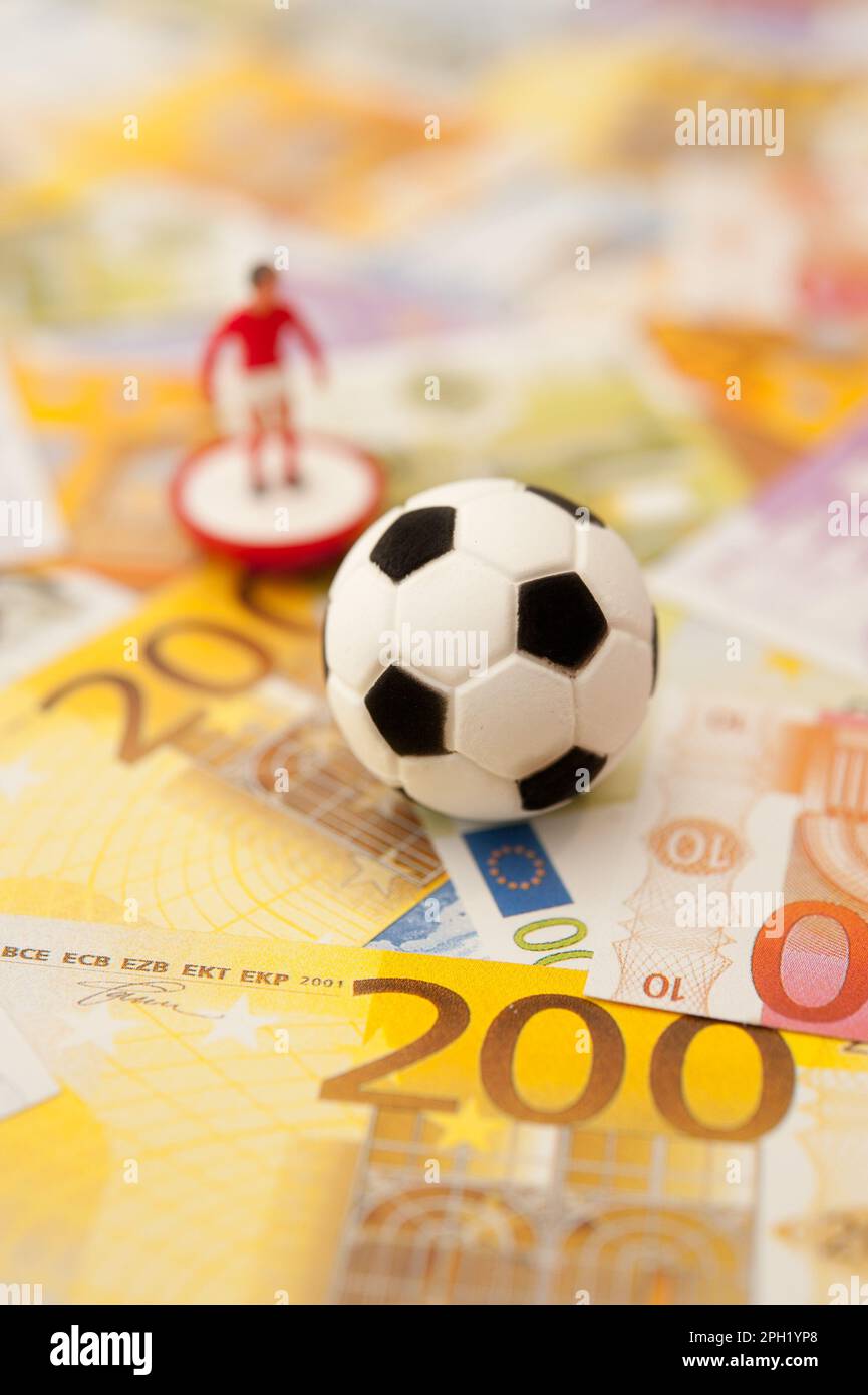 soccer ball and euro banknotes, sport as business concept Stock Photo Alamy