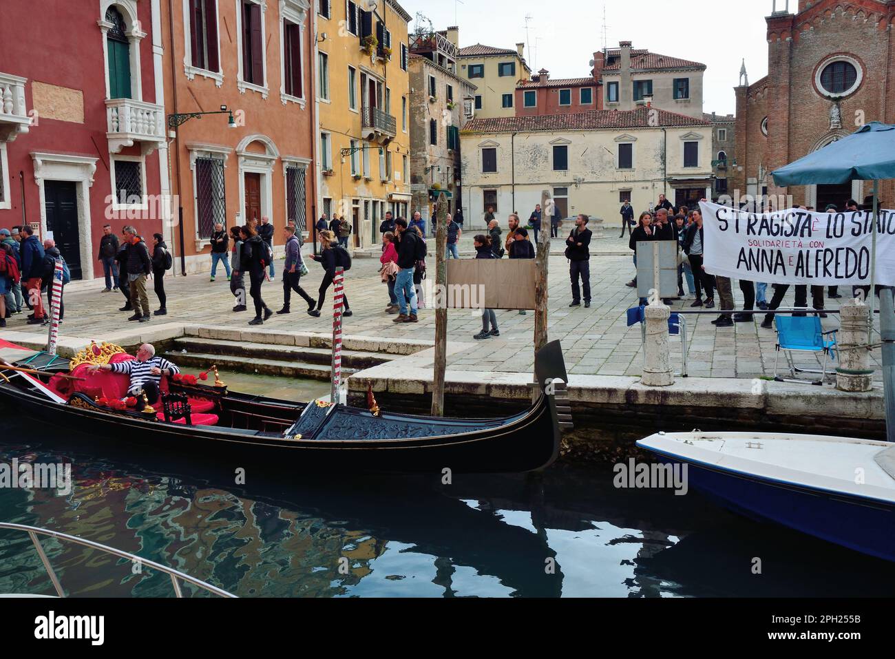 Venice, Italy. 25th Mar, 2023. 2000 policemen, closed shops, closed bridges and checking of the documents of passers-by, Campo dei Frari off limits, to contain an unauthorized demonstration of 500 anarchists. The peaceful marchers protest against the NATO war and in support of the jailed anarchists Juan Antonio Sorroche Fernandez and Alfredo Cospito and ask for the abolition of special detention as per article of law “41 bis”. Many slogans proclaim that “the time has come to do as in France”. Venice, Italy. March 25th, 2023. Credit: Ferdinando Piezzi/Alamy Live News Stock Photo